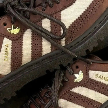 Adidas Samba footwear in brown earth tones with robust sole unit, essential for transitional weather outfits and urban exploration.