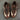 Aesthetic shot of brown Adidas Samba shoes with rugged tread, highlighting the premium suede texture and gold logo detail on side.
