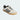 Adidas Gazelle Indoor White Black sneakers with a retro look, highlighting the gum rubber sole, black leather stripes, and gold foil 'GAZELLE' text printed on the side panel.